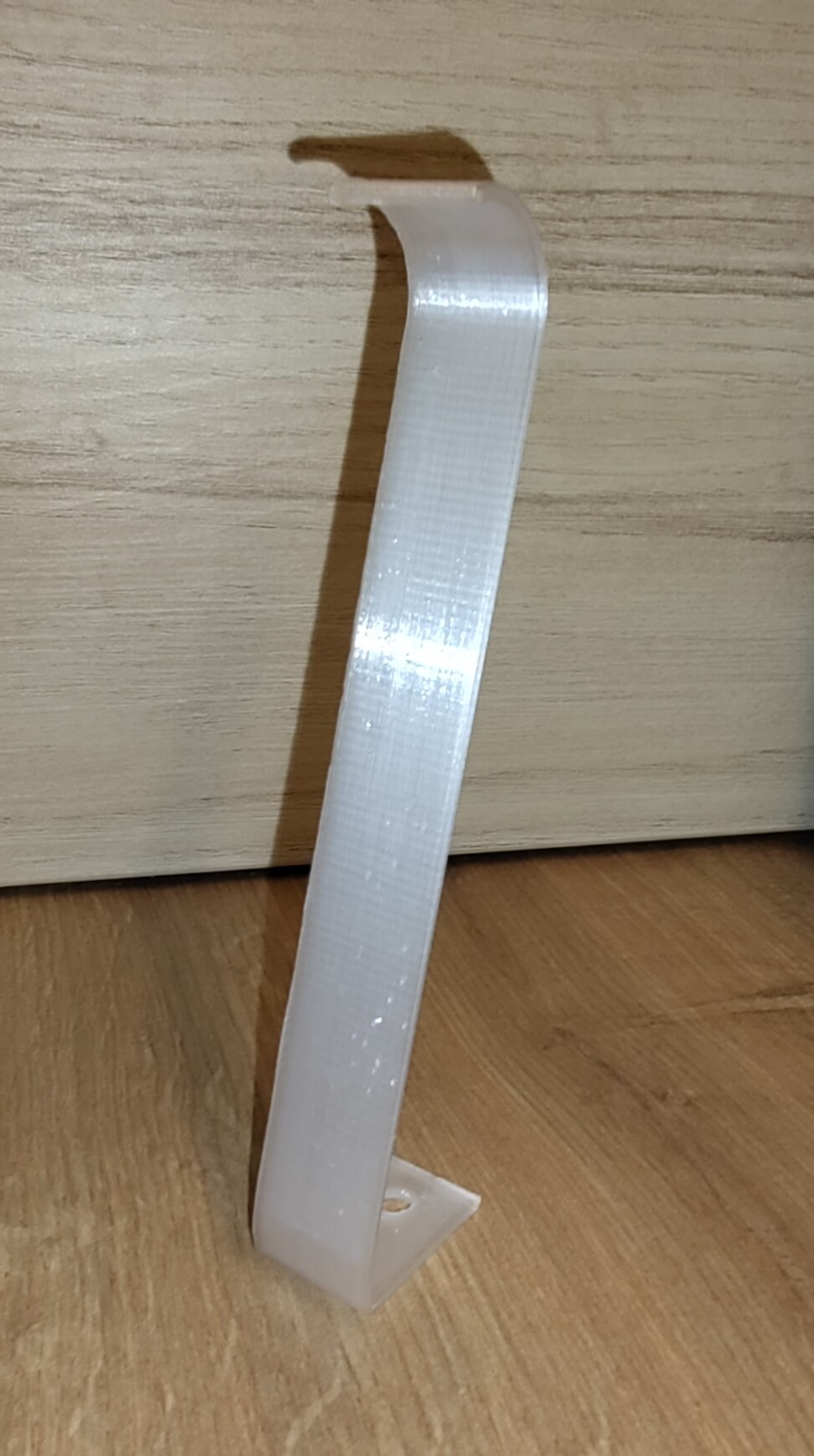 Darstellung einer Haltespange für Literatur.